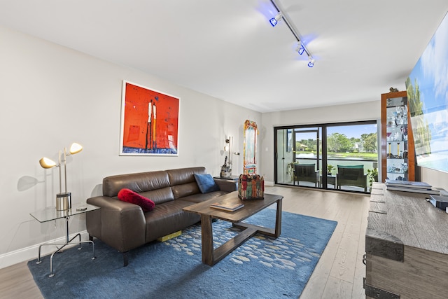 12829 Briarlake Dr Unit 102, Palm Beach Gardens, FL 33418 - living room with hardwood / wood-style floors, rail lighting, and baseboards