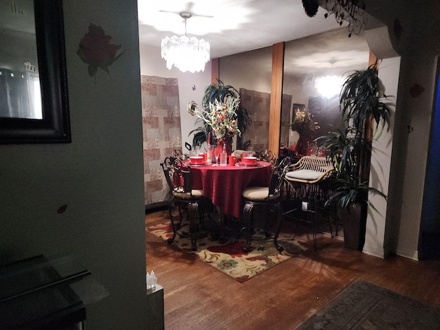 12845 NE 4th Ave, North Miami, FL 33161 - dining area featuring wood finished floors and a chandelier