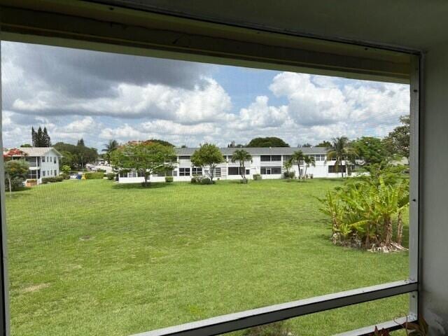 127 Berkshire F, West Palm Beach, FL 33417 - view of green lawn featuring a residential view