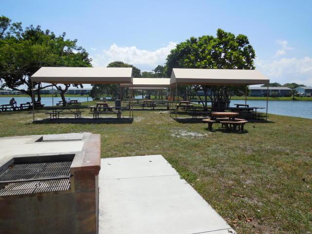 127 Berkshire F, West Palm Beach, FL 33417 - surrounding community featuring a gazebo, a lawn, and a water view