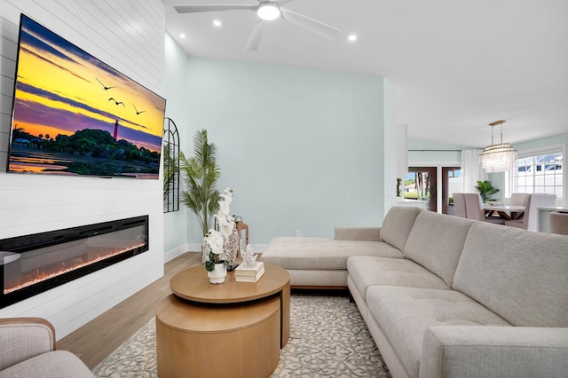 889 SW Balmoral Trce, Stuart, FL 34997 - living area featuring light wood-style flooring, a glass covered fireplace, ceiling fan, and recessed lighting