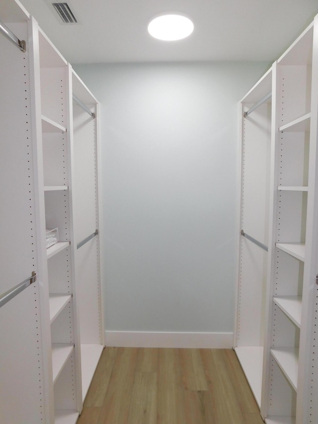 889 SW Balmoral Trce, Stuart, FL 34997 - spacious closet with light wood finished floors