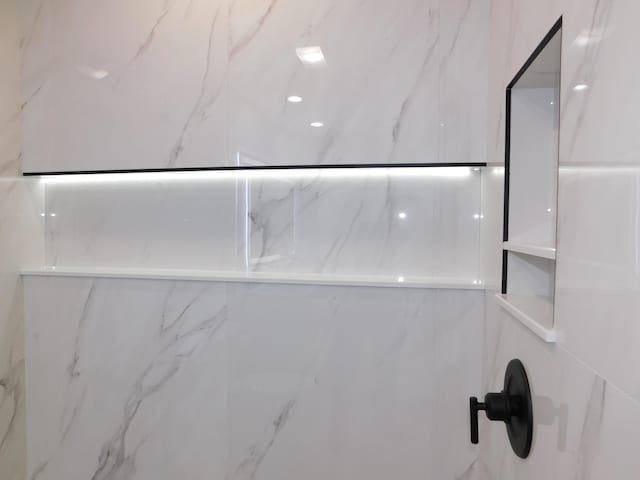 889 SW Balmoral Trce, Stuart, FL 34997 - bathroom view of a marble finish shower