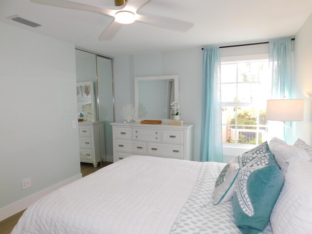 889 SW Balmoral Trce, Stuart, FL 34997 - bedroom featuring ceiling fan and a closet