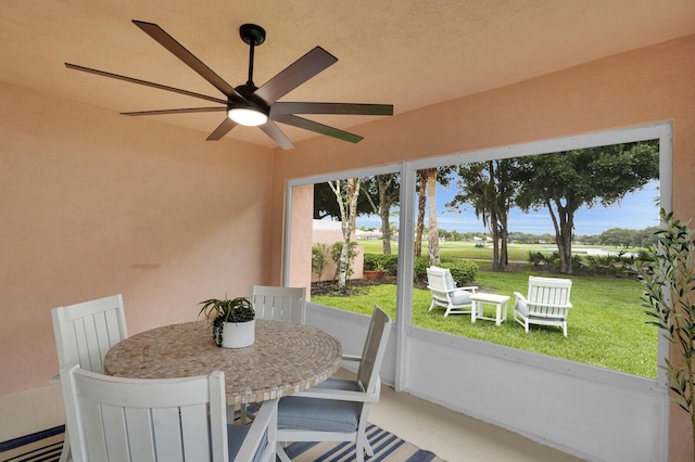 889 SW Balmoral Trce, Stuart, FL 34997 - sunroom with ceiling fan, a baseboard radiator, and healthy amount of natural light