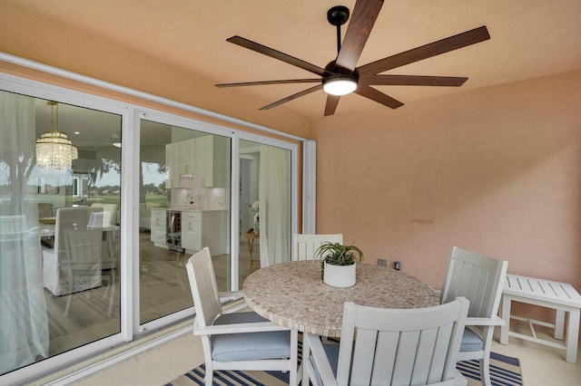 889 SW Balmoral Trce, Stuart, FL 34997 - sunroom featuring wine cooler and a chandelier