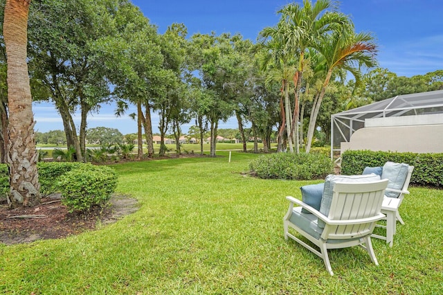889 SW Balmoral Trce, Stuart, FL 34997 - view of grassy yard featuring glass enclosure