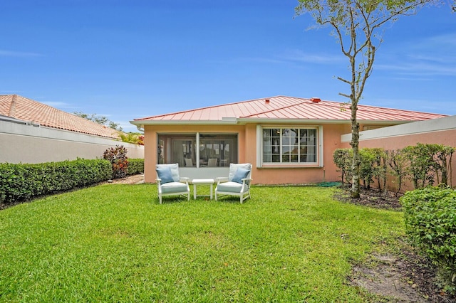 889 SW Balmoral Trce, Stuart, FL 34997 - rear view of property featuring a standing seam roof, a sunroom, metal roof, and stucco siding