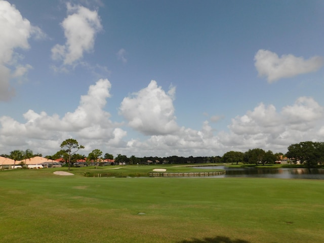 889 SW Balmoral Trce, Stuart, FL 34997 - view of community with a water view, golf course view, and a yard