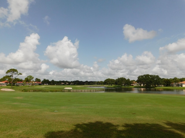 889 SW Balmoral Trce, Stuart, FL 34997 - view of community with a water view, golf course view, and a yard