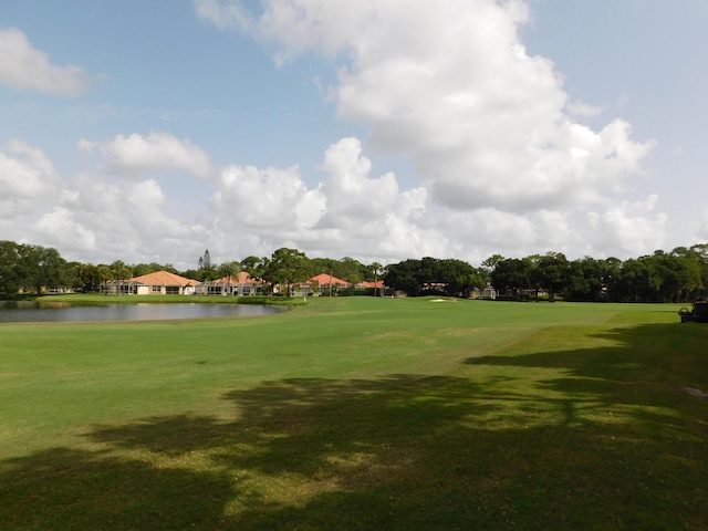 889 SW Balmoral Trce, Stuart, FL 34997 - view of home's community featuring a water view, view of golf course, and a lawn