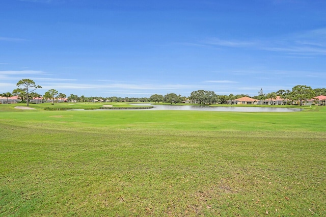 889 SW Balmoral Trce, Stuart, FL 34997 - surrounding community with a water view, a yard, and golf course view