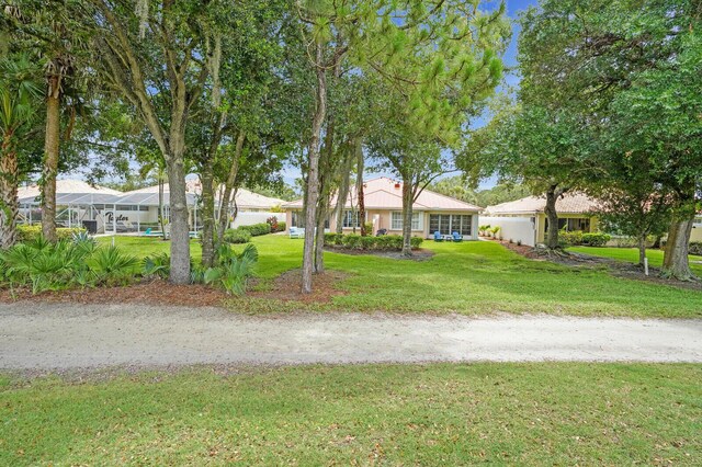 889 SW Balmoral Trce, Stuart, FL 34997 - surrounding community with a water view, a yard, and golf course view