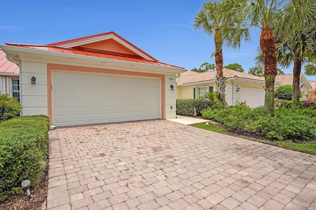 889 SW Balmoral Trce, Stuart, FL 34997 - single story home featuring decorative driveway, a garage, and stucco siding