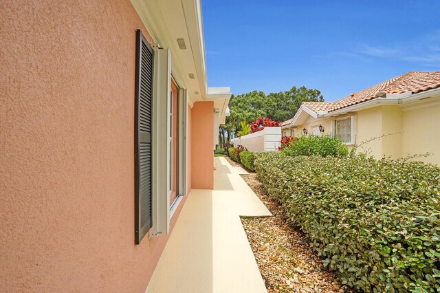 889 SW Balmoral Trce, Stuart, FL 34997 - ranch-style house featuring decorative driveway, stucco siding, and a garage