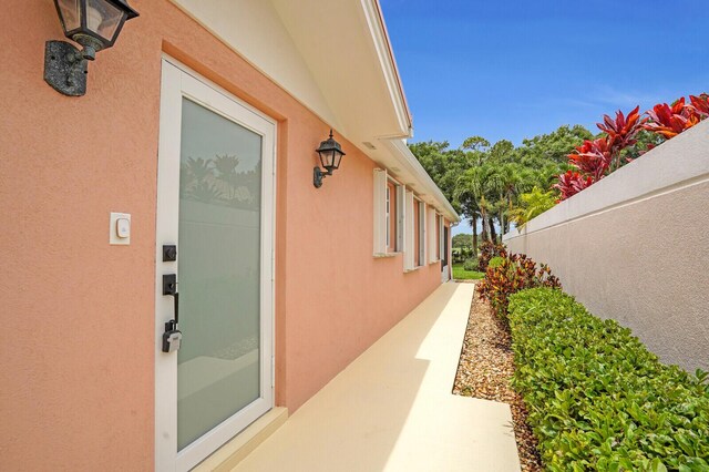889 SW Balmoral Trce, Stuart, FL 34997 - view of side of home with stucco siding