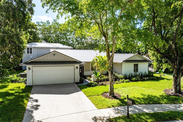 3356 NW 24th Way, Boca Raton, FL 33431 - view of front of house featuring a garage, concrete driveway, a front yard, and brick siding