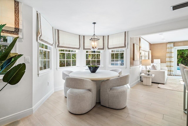 3356 NW 24th Way, Boca Raton, FL 33431 - dining space with wood finished floors and a chandelier