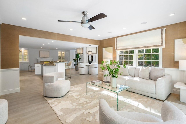 3356 NW 24th Way, Boca Raton, FL 33431 - living room with ceiling fan, light wood-style flooring, wainscoting, and recessed lighting