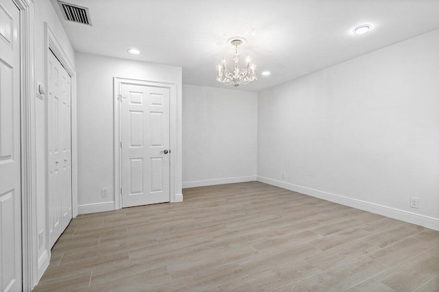 3356 NW 24th Way, Boca Raton, FL 33431 - unfurnished bedroom with a chandelier, light wood-style floors, and recessed lighting