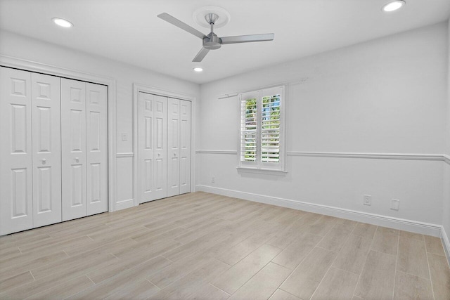 3356 NW 24th Way, Boca Raton, FL 33431 - unfurnished bedroom featuring two closets, light wood-type flooring, recessed lighting, and ceiling fan