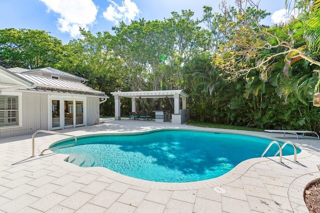 3356 NW 24th Way, Boca Raton, FL 33431 - swimming pool with a pergola, a patio area, and view of wooded area