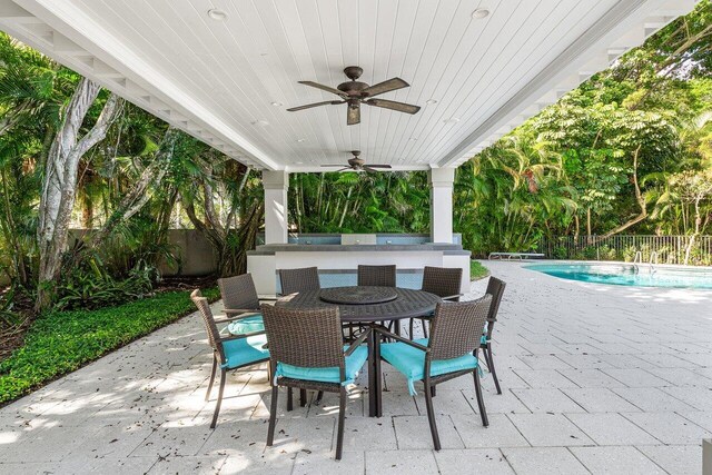 3356 NW 24th Way, Boca Raton, FL 33431 - fenced backyard featuring a patio area, a ceiling fan, and outdoor dining area