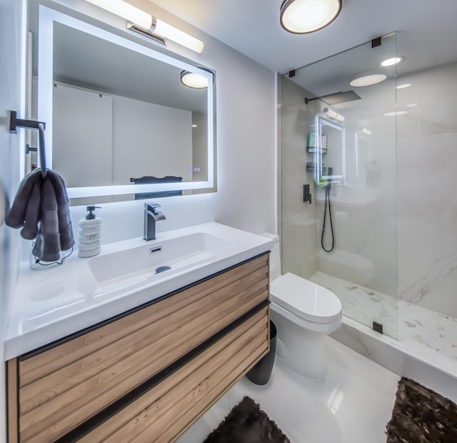 1428 S Lakeside Dr Unit 31, Lake Worth Beach, FL 33460 - bathroom featuring toilet, a walk in shower, and vanity
