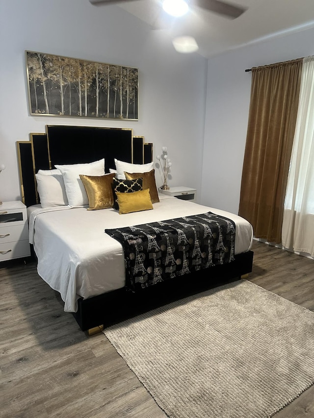 1583 SW Harbour Isles Cir Unit 57, Port Saint Lucie, FL 34986 - bedroom featuring wood finished floors and a ceiling fan