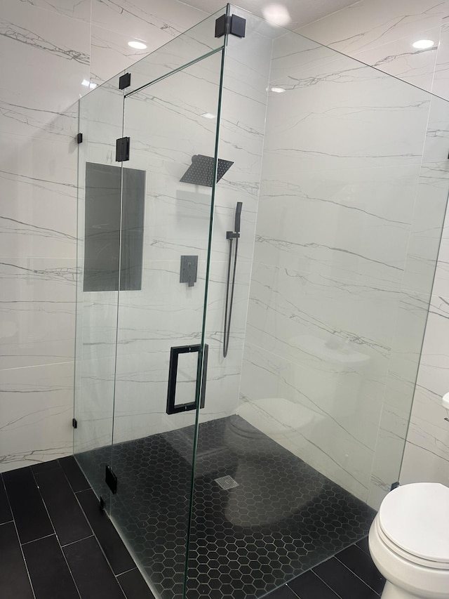 1583 SW Harbour Isles Cir Unit 57, Port Saint Lucie, FL 34986 - bathroom featuring toilet, tile patterned floors, and a marble finish shower