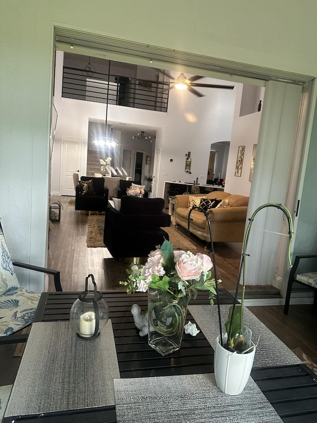 1583 SW Harbour Isles Cir Unit 57, Port Saint Lucie, FL 34986 - dining area with wood finished floors, ceiling fan, and a towering ceiling