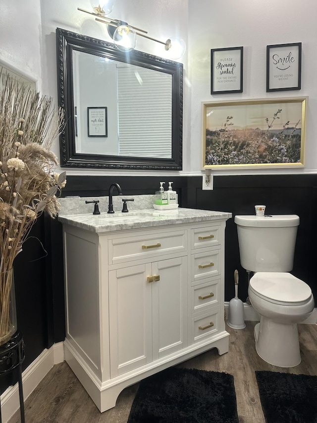 1583 SW Harbour Isles Cir Unit 57, Port Saint Lucie, FL 34986 - bathroom with wood finished floors, vanity, and toilet