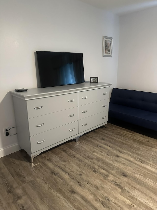 1583 SW Harbour Isles Cir Unit 57, Port Saint Lucie, FL 34986 - living room featuring dark wood-type flooring and baseboards