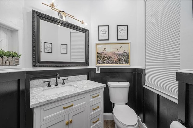 1583 SW Harbour Isles Cir Unit 57, Port Saint Lucie, FL 34986 - half bath with toilet, vanity, and wainscoting