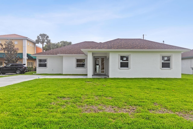 4037 SW Port St Lucie Blvd, Port Saint Lucie, FL 34953 - single story home with french doors, stucco siding, a front yard, and roof with shingles
