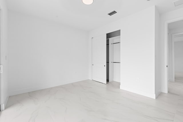 4037 SW Port St Lucie Blvd, Port Saint Lucie, FL 34953 - unfurnished bedroom with marble finish floors, baseboards, and a closet