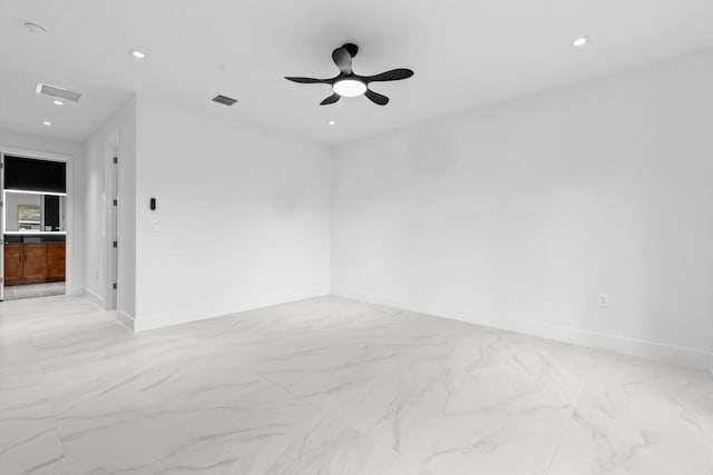 4037 SW Port St Lucie Blvd, Port Saint Lucie, FL 34953 - spare room featuring light marble finish flooring, ceiling fan, baseboards, and recessed lighting