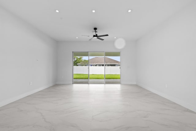 4037 SW Port St Lucie Blvd, Port Saint Lucie, FL 34953 - empty room featuring marble look tiles, a ceiling fan, baseboards, and recessed lighting