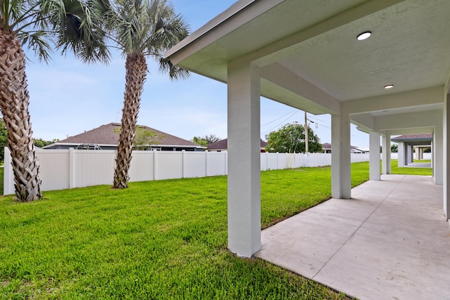 4037 SW Port St Lucie Blvd, Port Saint Lucie, FL 34953 - view of yard featuring a patio area