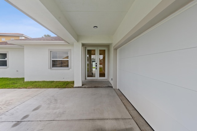 4037 SW Port St Lucie Blvd, Port Saint Lucie, FL 34953 - view of exterior entry with a patio area, french doors, and stucco siding