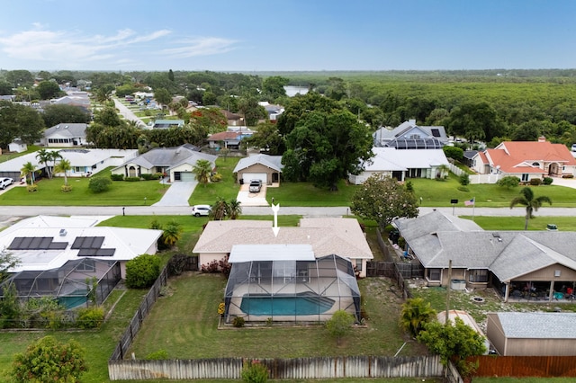 858 SE Roulette Ln, Port Saint Lucie, FL 34983 - aerial perspective of suburban area with a pool