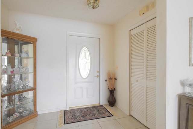 858 SE Roulette Ln, Port Saint Lucie, FL 34983 - foyer featuring light tile patterned flooring