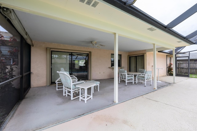 858 SE Roulette Ln, Port Saint Lucie, FL 34983 - view of patio / terrace with a ceiling fan, glass enclosure, and outdoor dining space