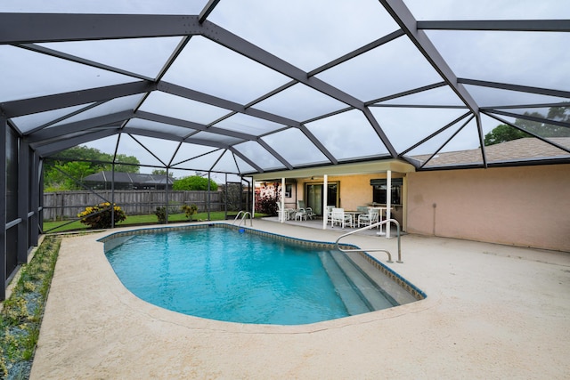 858 SE Roulette Ln, Port Saint Lucie, FL 34983 - view of pool with a patio area, a fenced backyard, and a lanai