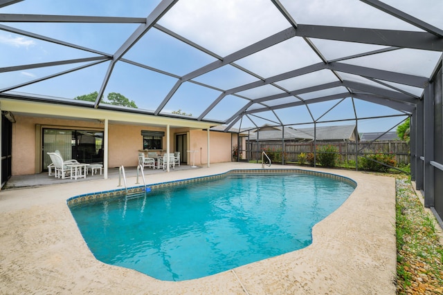 858 SE Roulette Ln, Port Saint Lucie, FL 34983 - view of swimming pool with a patio, a fenced backyard, outdoor dining area, and glass enclosure