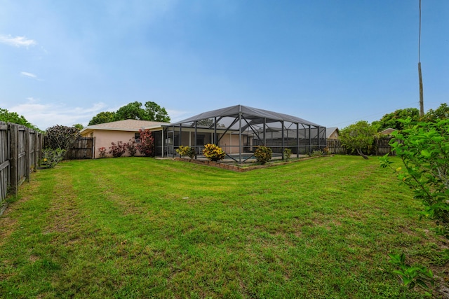 858 SE Roulette Ln, Port Saint Lucie, FL 34983 - view of yard featuring glass enclosure