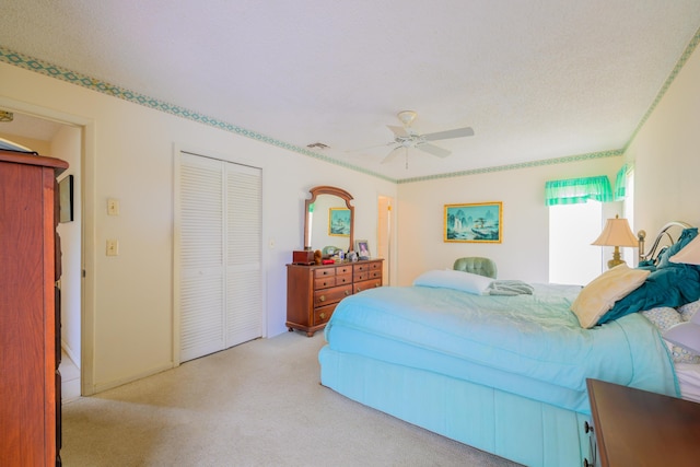 858 SE Roulette Ln, Port Saint Lucie, FL 34983 - bedroom with carpet floors, a closet, and a ceiling fan
