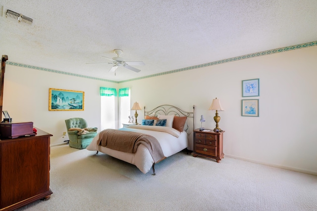 858 SE Roulette Ln, Port Saint Lucie, FL 34983 - bedroom featuring carpet, a textured ceiling, and a ceiling fan