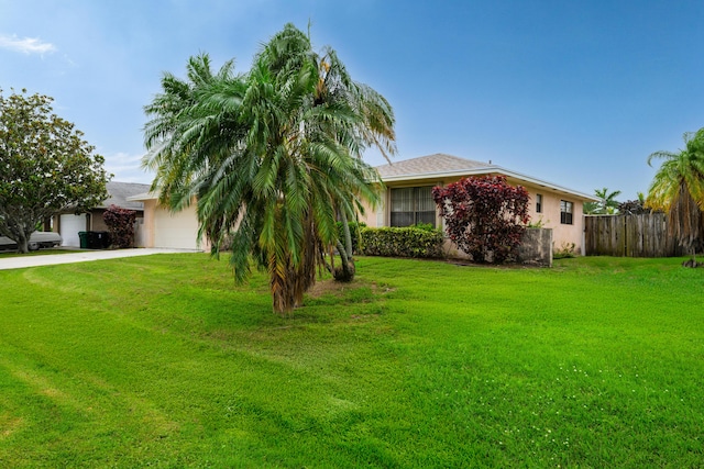 858 SE Roulette Ln, Port Saint Lucie, FL 34983 - view of front facade featuring a garage, driveway, and stucco siding