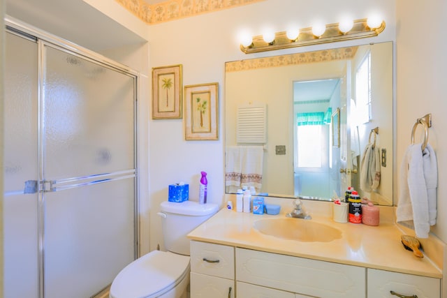858 SE Roulette Ln, Port Saint Lucie, FL 34983 - bathroom with vanity, a shower with door, and toilet